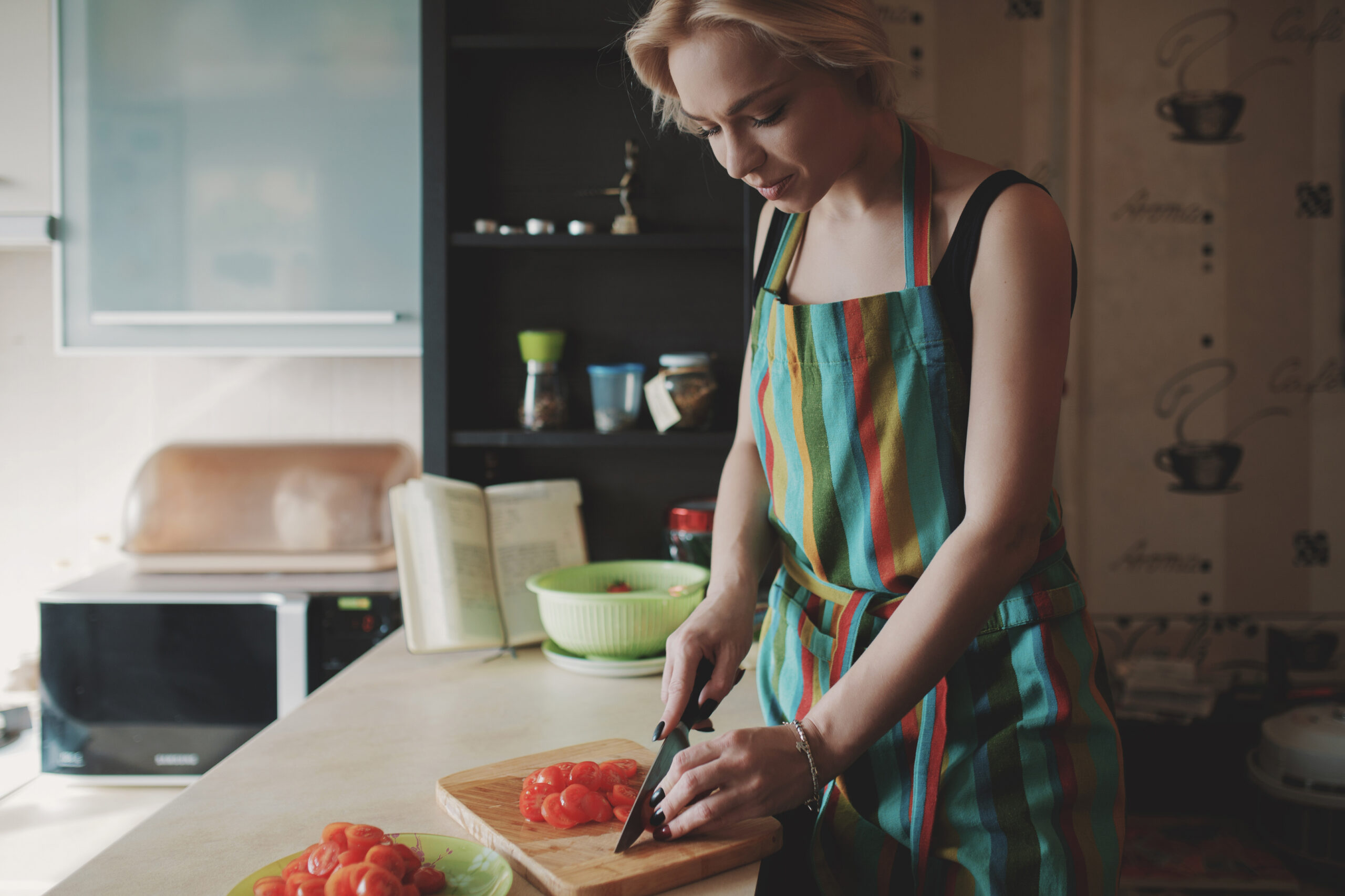 young-woman-slicing-tomatoes-scaled.jpg